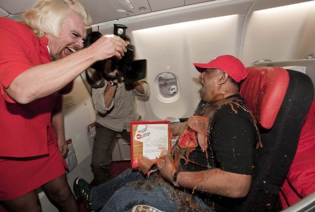 Richard Branson Dresses in Drag to Serve Flight Passengers…