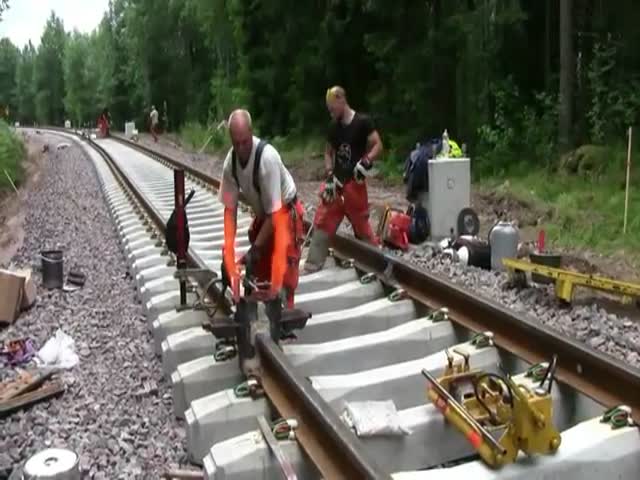 Thermite Welders at Work on a Railroad Track in Sweden 