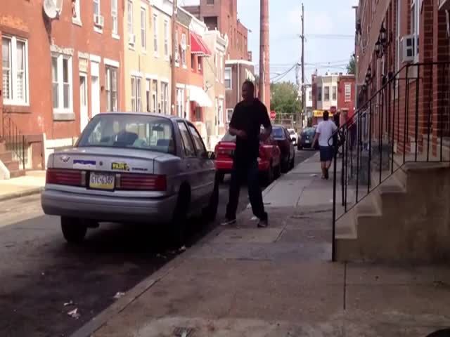 Weird Guy Attacks Car, Knocks Himself Out! 