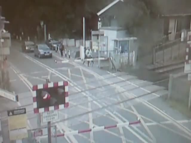 Cyclist's Terrifying Near Miss with a Train at a Railroad Crossing 