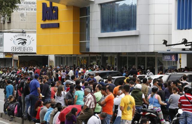 People Flock to Chain Stores for Bargain Shopping in Caracas