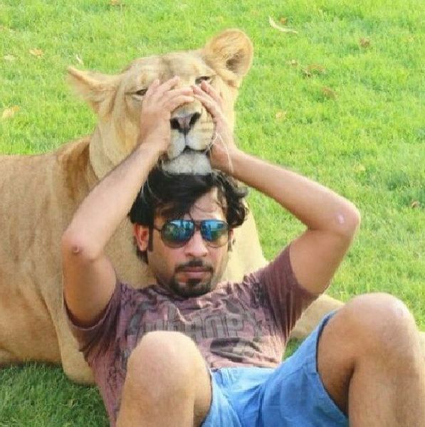 Rich Dudes Pose with Lions for Prestige