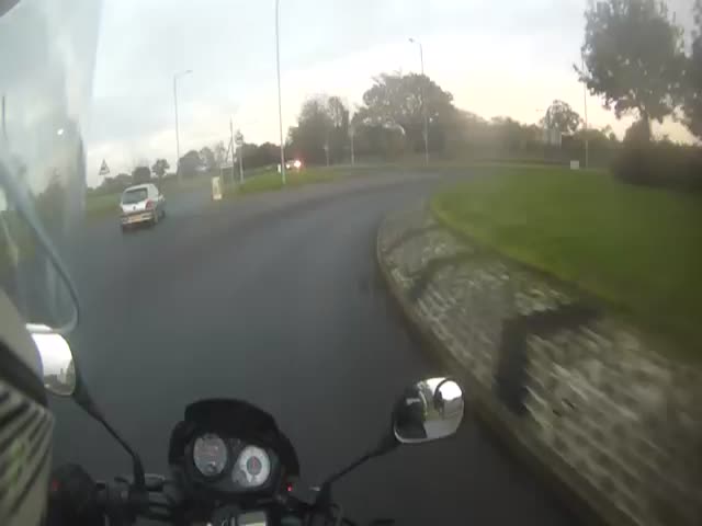 Biker Crashes on Roundabout, Concerned Drivers Pop Out from Everywhere 