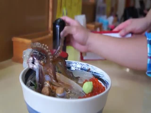 Would You Dare to Eat a Dish That Still Moves?  (VIDEO)