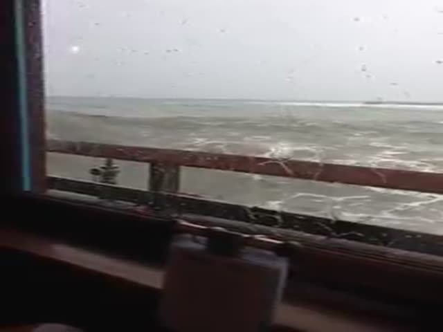 Huge Wave Crashes through Restaurant Windows  (2 videos)