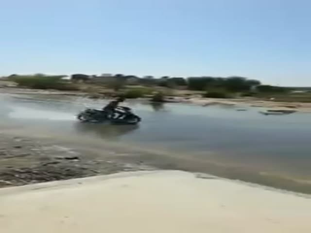 Drifting on Water Covered Road with a Scooter  (VIDEO)