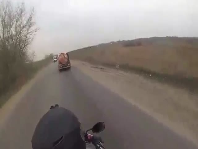 Biker Slams Straight into a Truck Door  (VIDEO)