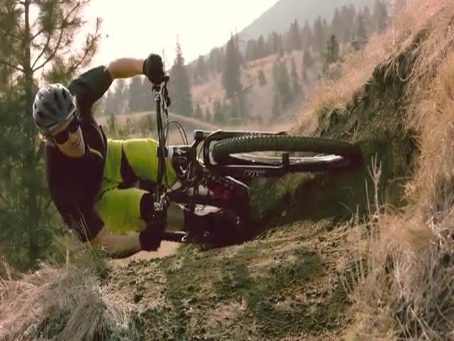 Mountain Biker Takes a Sharp Turn in parallel to the Ground 