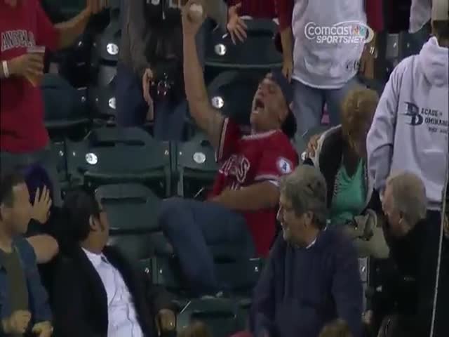 Dude Gets Himself a Foul Ball but Old Woman Has to Pay the Price for It  (VIDEO)