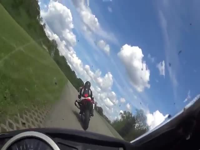 Biker Gets Wiped Out by a Flying Motorcycle  (VIDEO)
