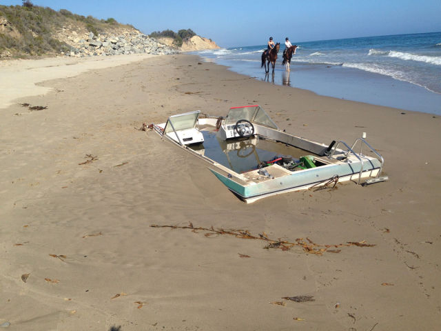 A Surprisingly Big Boat Found Buried on the Beach