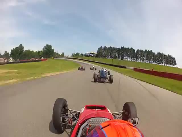 Racer Nearly Gets Decapitated by Formula Car  (VIDEO)