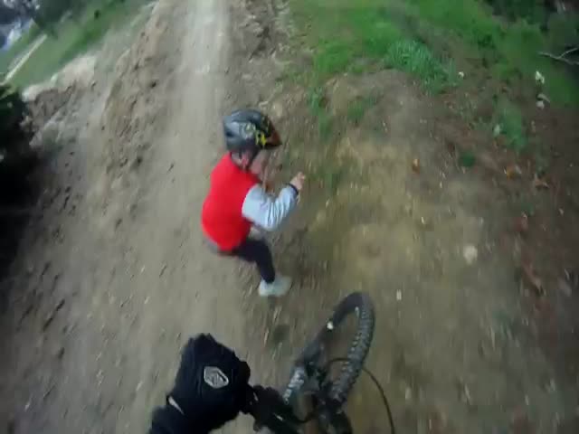 Mountain Biker Crashes into Kid on Active Bike Track 