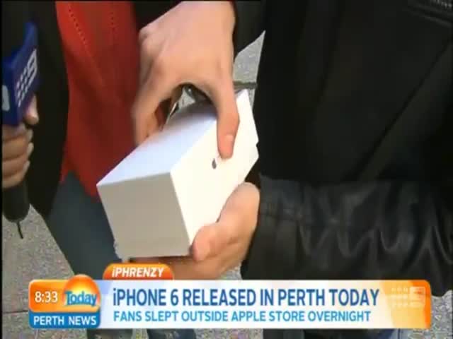 First Person to Buy an iPhone 6 Drops It on Live TV  (VIDEO)
