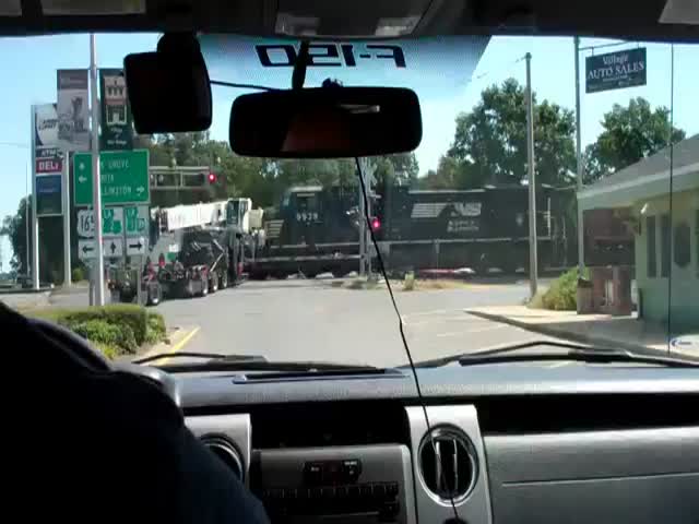 Train Hits Semi-Trailer Truck Stuck on the Tracks  (VIDEO)