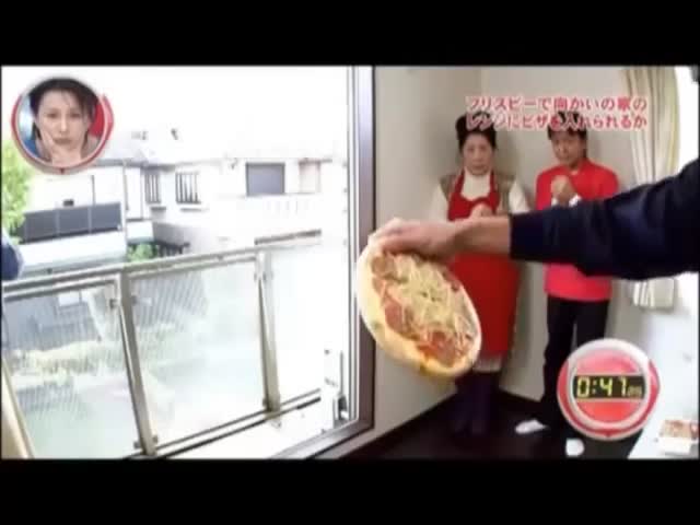 Throwing a Pizza into a Microwave 20 Meters Away, Frisbee Style!  (VIDEO)