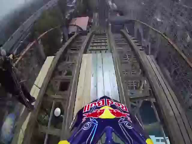 Daredevil Rides Motorcycle on Roller Coaster tracks 