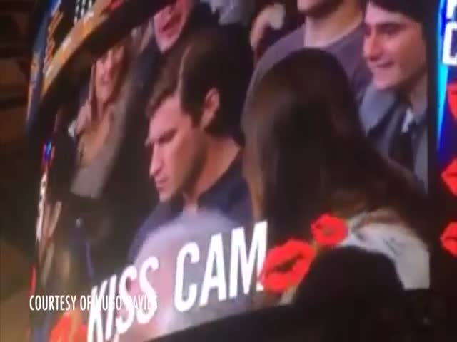 Girl Kisses Another Guy after Boyfriend Ignores the Kiss Cam  (VIDEO)