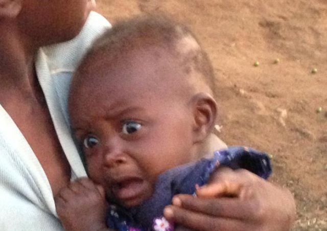 An African Baby’s Hilarious Response to Seeing a White Person for the First Time