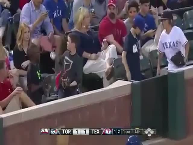 Kid's Smooth Move to Impress a Girl at a Baseball Game  (VIDEO)