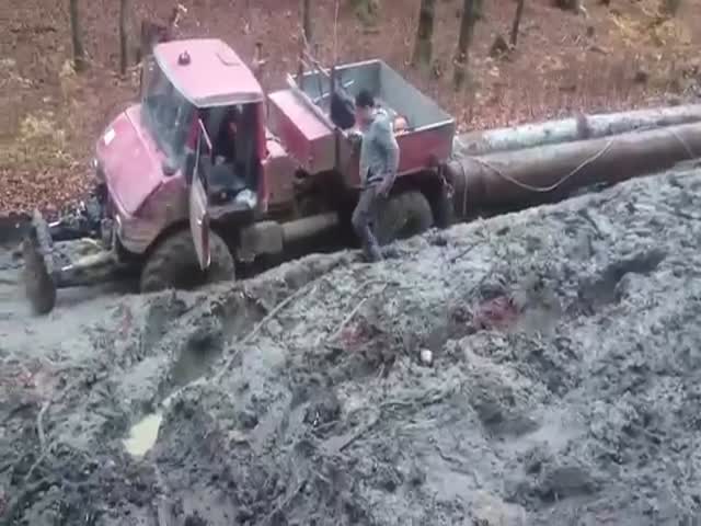 Unimog Truck Pulling Lumber through the Mud like It's Nothing  (VIDEO)