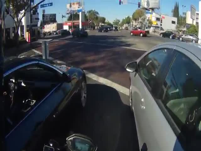 An Unexpected Road Rage Encounter between a Motorcycle and a Car