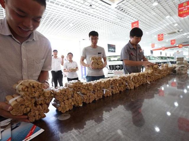 Chinese Man Buys a New Car with Coins