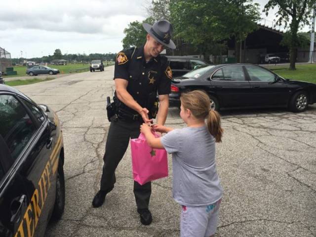 Caring Police Officer Supports a Young Girl with a Dream