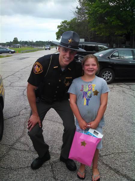 Caring Police Officer Supports a Young Girl with a Dream
