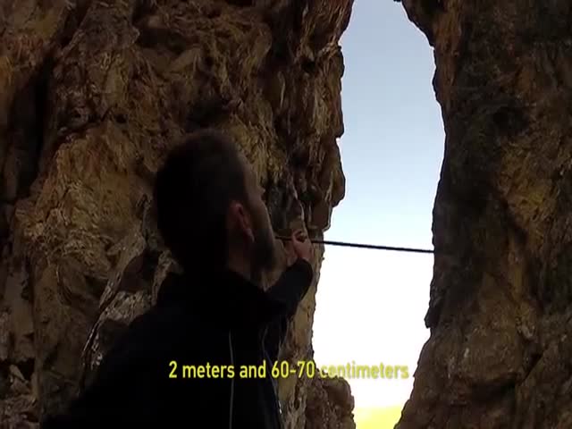 Daredevil Dives through a Small Cave Opening Wearing Only a Wingsuit