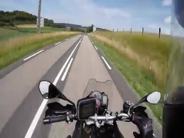 Motorcyclist in Near Head-on Collision with Flyaway Open Truck Gate