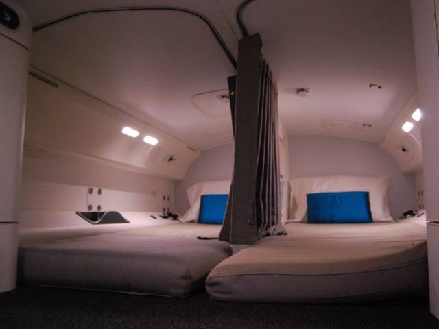 Inside the Airplane Bedrooms Where Flight Attendants Sleep on Long Flights