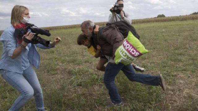 Hungarian Camerawoman Loses Her Job after Kicking Refugees on Camera