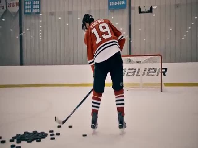 Jonathan Toews Effortlessly Nails a Water Bottle with a Cool Ice Hockey Puck Shot