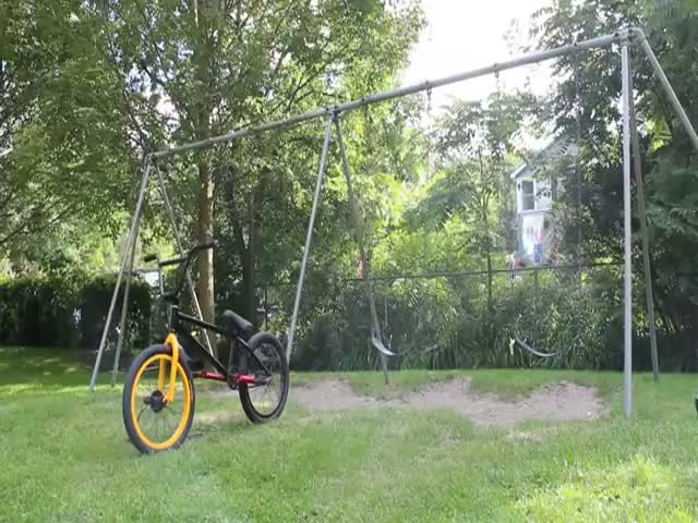 Teen Backflips from a Swing Straight onto a Bicycle
