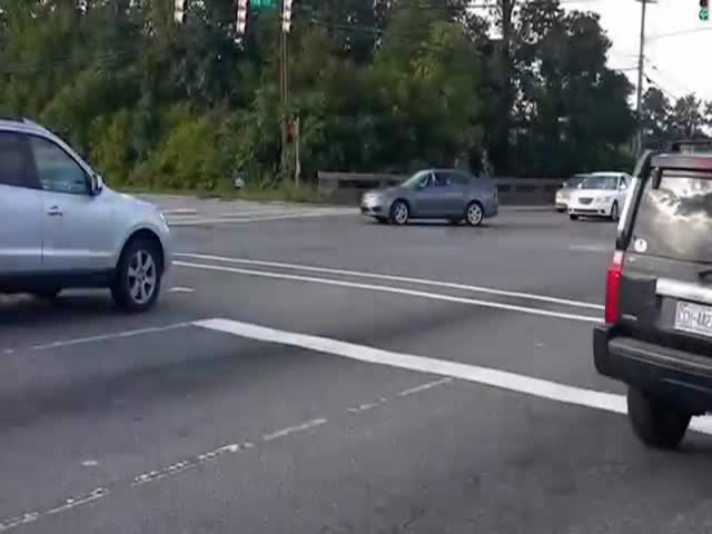 Insane Female Driver Flips Her Car While Doing Donuts in the Middle of an Intersection