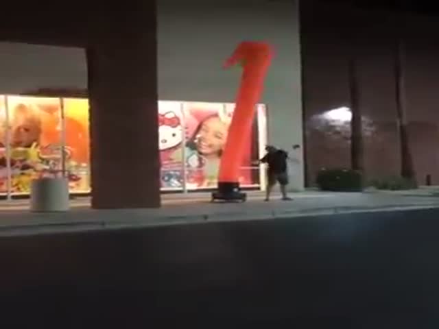 Inflatable Waving Tube Man Inspires a Man to A Random Dance off on the Streets