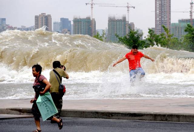 Chinese Locals Dodge Death By Getting Scarily Close to a Tidal Wave for Fun