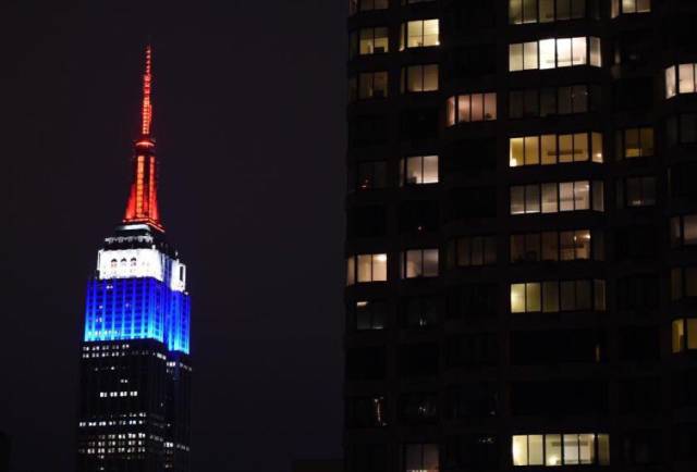 World Landmarks Light Up in Red, White and Blue in Support of France