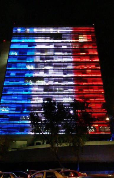 World Landmarks Light Up in Red, White and Blue in Support of France