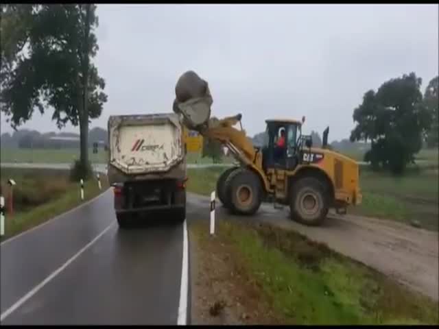 Truck Almost Gets Bounced Over by an Heavy Load