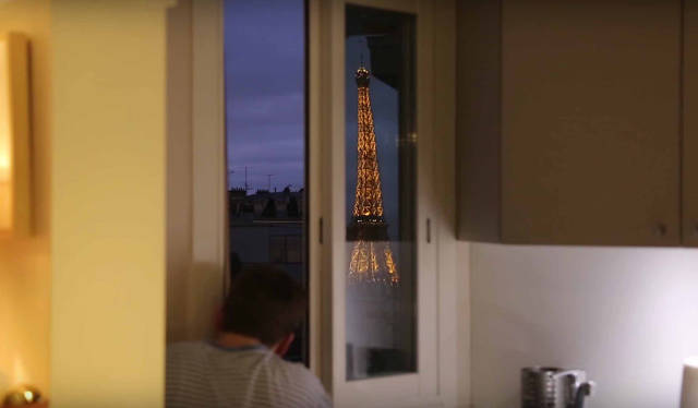 This Man Has a Unique View of the Eiffel Tower Straight from the Comfort of His Own Bed