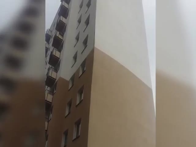 Strong Winds Tear Off Building's External Wall Coating