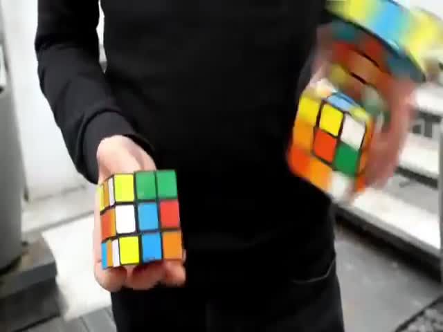 Man Solves 3 Rubik's Cubes. At The Same Time. While Juggling!