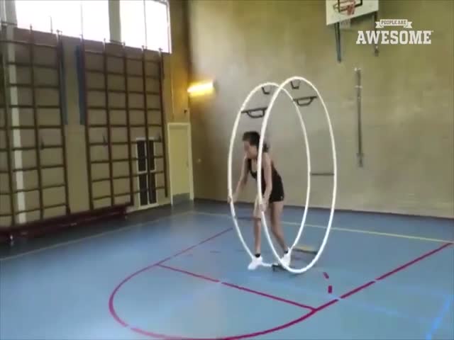 A Girl Makes A Great Performance With A Wheel