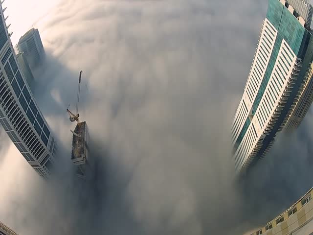 Base Jumper Makes A Leap Of Faith Into The Clouds