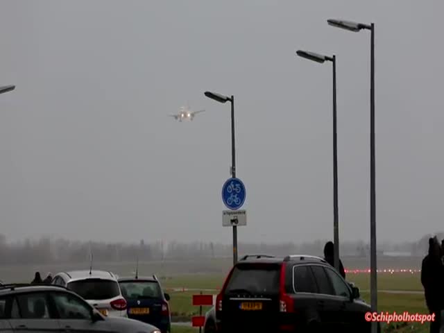 A Swiss A320 Doing A Touch And Go Around In Bad Weather At Amsterdam Schiphol Airport